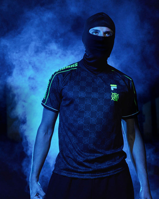 Shinobi Shozoku - NIPxFILA Jersey, a merch collaboration between Ninjas in Pyjamas and FILA. This sleek and stylish jersey showcases the logos of both brands, making it the perfect choice for NIP fans who want to express their passion for the team and fashion in a unique and trendy way.