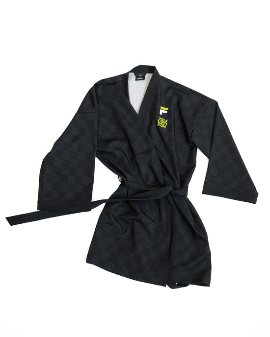 NIP X FILA - Yukata from Ninjas in Pyjamas Shop. NIP X FILA Yukata, featuring a unique collaboration design with the Ninjas in Pyjamas and FILA logos. This special edition Yukata offers a blend of traditional Japanese style and esports flair, making it a must-have for fans who want to express their passion for NIP in a distinctive and fashionable way.