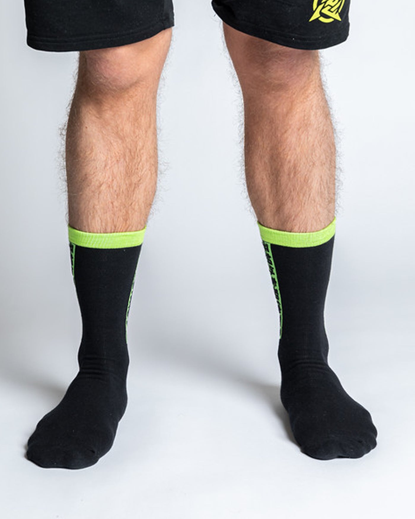 A pair of black socks with neon inlays and the Ninjas in Pyjamas logo from NIP merch collection. These comfortable and stylish socks are designed to represent your passion for NIP while adding a touch of ninja-inspired flair to your everyday outfit.