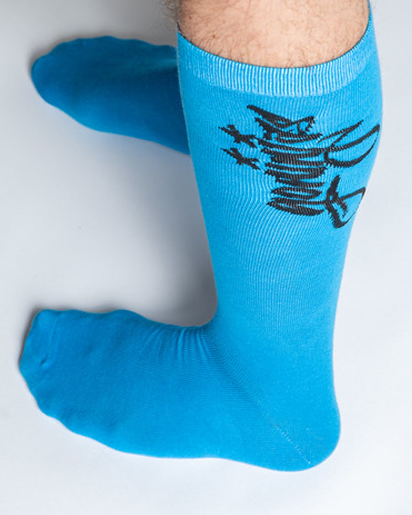 A pair of classic blue socks with the Ninjas in Pyjamas logo from NIP merch collection. These comfortable and stylish socks are designed to represent your passion for NIP and esports while adding a touch of ninja-inspired flair to your everyday outfit.