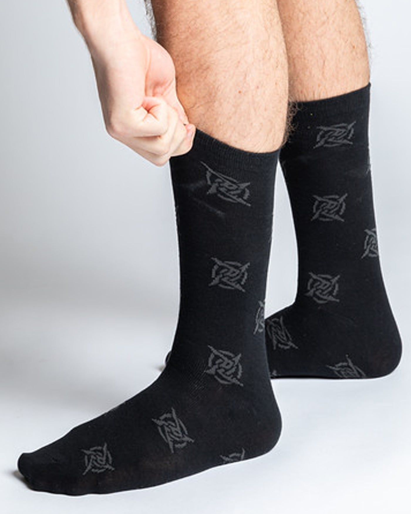 A pair of classic black socks with the Ninjas in Pyjamas logo from NIP merch collection. These comfortable and stylish socks are designed to represent your passion for NIP while adding a touch of ninja-inspired flair to your everyday outfit.