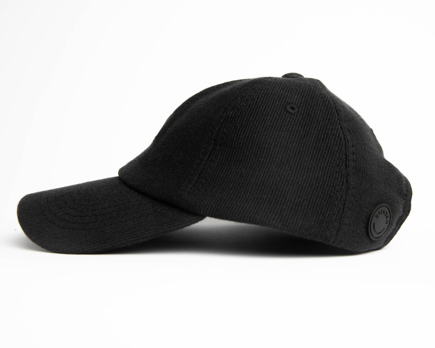 A black ninja cap from the NIP X Stiksen merch collaboration, featuring the Ninjas in Pyjamas logo subtly embroidered on the front. This stylish and adjustable cap is perfect for showcasing your support for NIP in a sleek and trendy way.