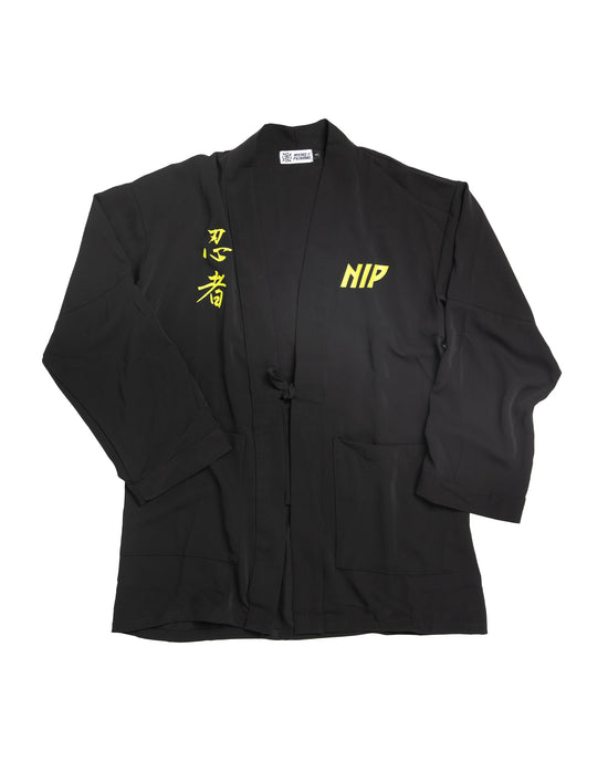 Ninjutsu Collection - Uwagi Jacket from Ninjas in Pyjamas Shop. Uwagi Jacket from the Ninjutsu Merch Collection, featuring the Ninjas in Pyjamas logo subtly embroidered on the chest. This sleek and stylish jacket is perfect for showcasing your support for NIP while adding a touch of Japanese-inspired flair to your wardrobe.